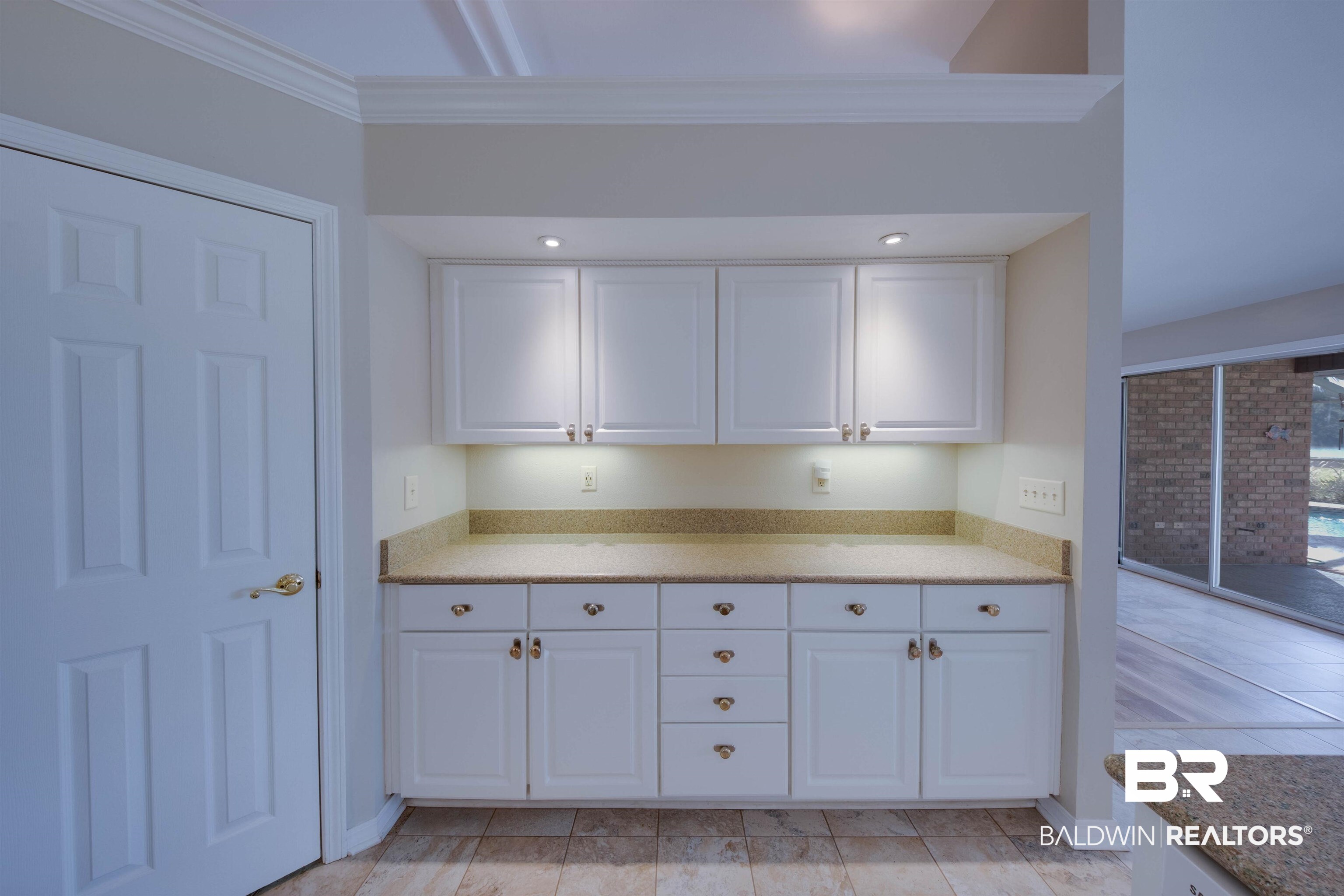 9462 Lakeview Drive Foley, AL 36535 - Photo 15 of 50 Kitchen featuring ornamental molding and white cabinetry