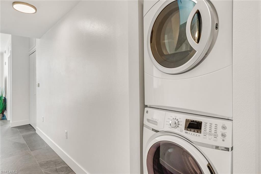 3000 Oasis Grand Boulevard, Unit 606 Fort Myers, FL 33916 - Photo 12 of 47 a utility room with dryer and washer