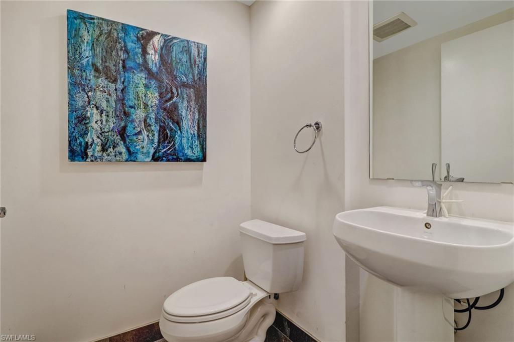 3000 Oasis Grand Boulevard, Unit 606 Fort Myers, FL 33916 - Photo 14 of 47 a bathroom with a toilet and a sink