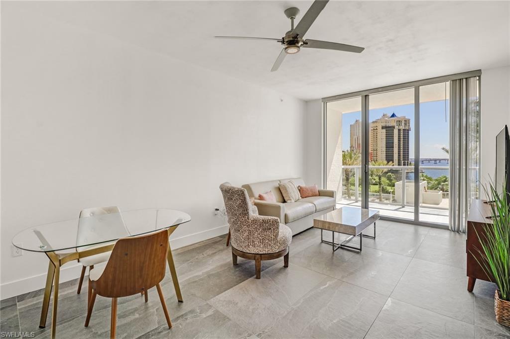 3000 Oasis Grand Boulevard, Unit 606 Fort Myers, FL 33916 - Photo 16 of 47 a living room with furniture and a window