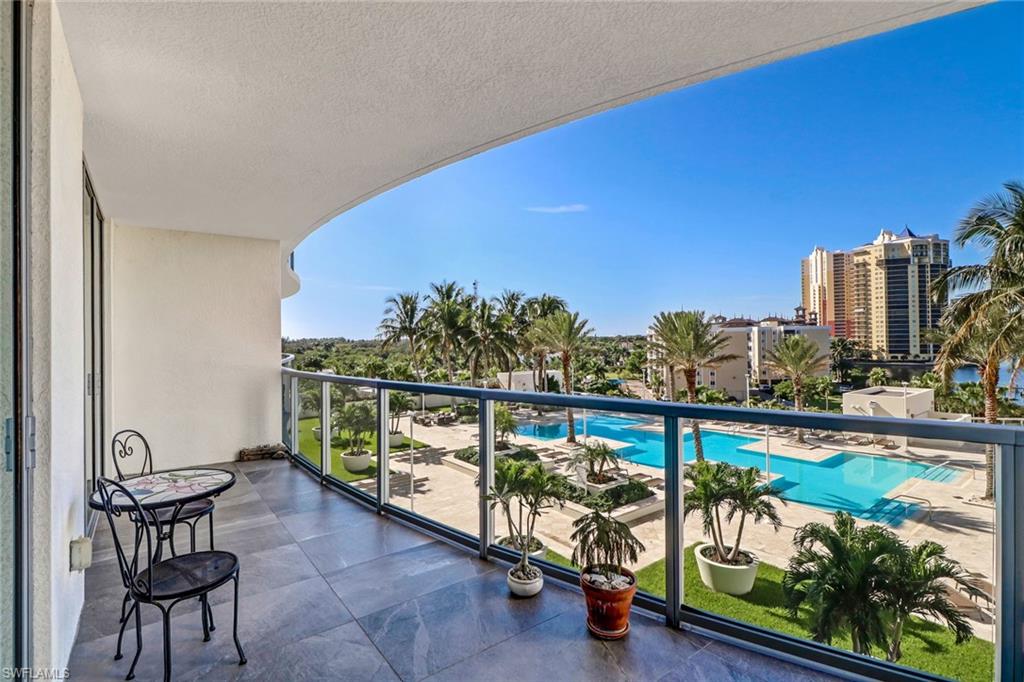 3000 Oasis Grand Boulevard, Unit 606 Fort Myers, FL 33916 - Photo 30 of 47 a view of a chairs and table in the balcony