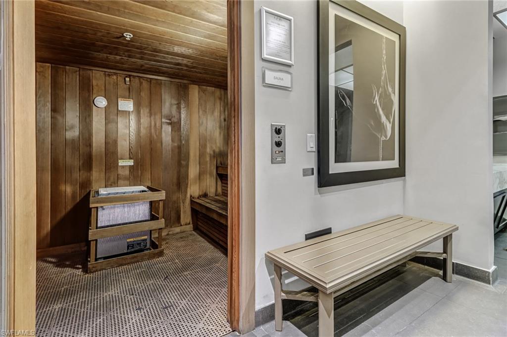 3000 Oasis Grand Boulevard, Unit 606 Fort Myers, FL 33916 - Photo 42 of 47 a room with a bed and a mirror