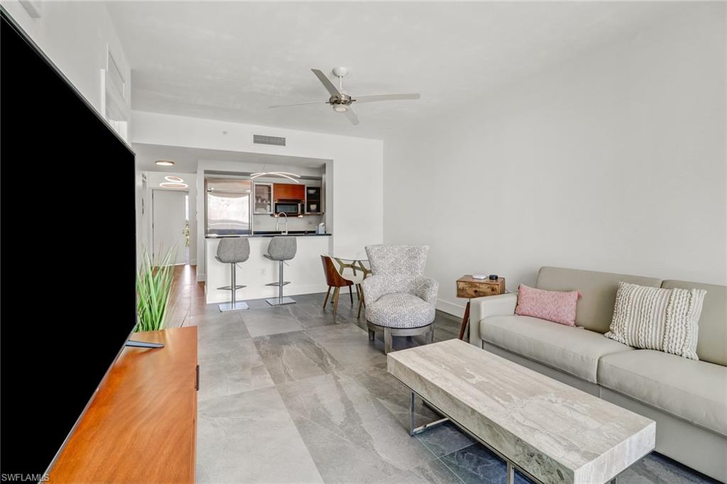 3000 Oasis Grand Boulevard, Unit 606 Fort Myers, FL 33916 - Photo 8 of 47 a living room with furniture and a couch