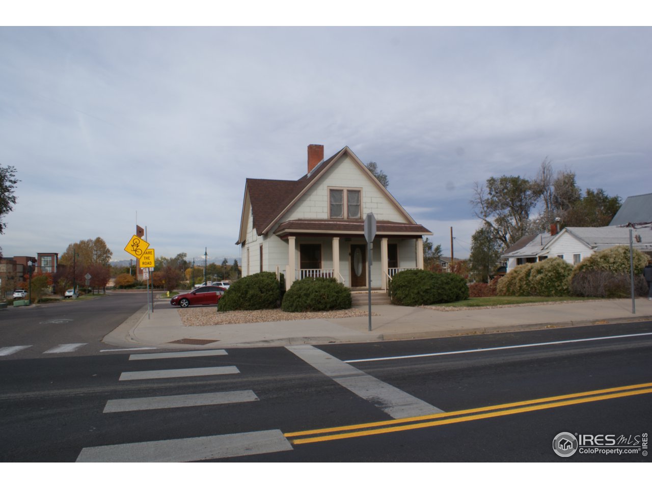 175 South Main Street Brighton, CO 80601 - Photo 1 of 13 a front view of a house with a yard