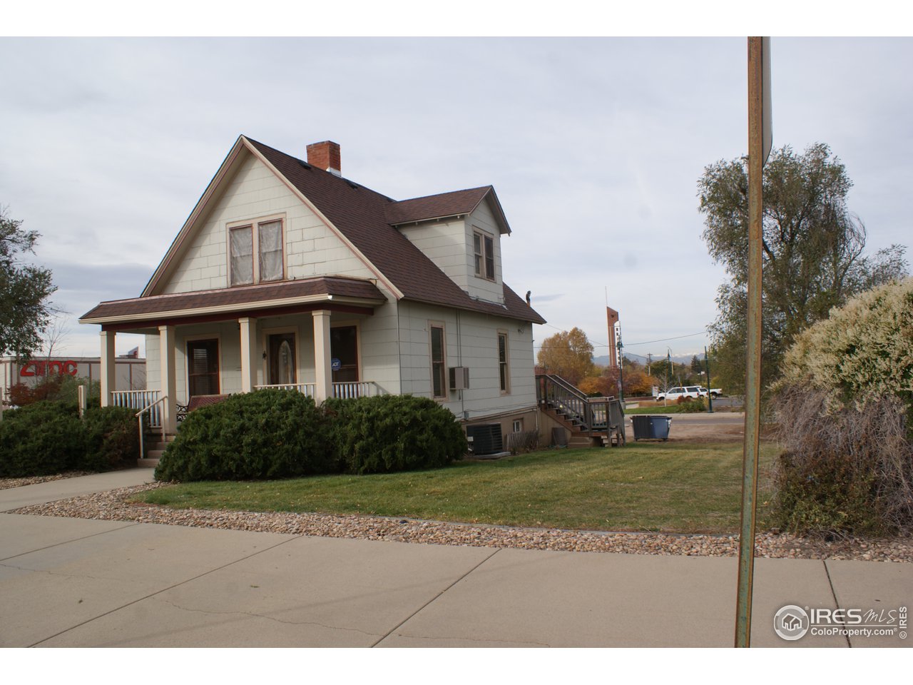175 South Main Street Brighton, CO 80601 - Photo 2 of 13 a view of a yard in front of a house with plants