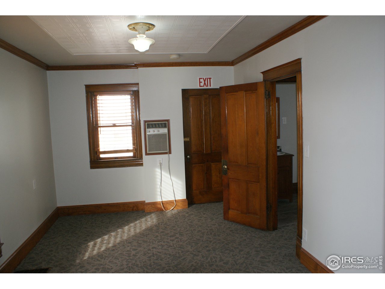 175 South Main Street Brighton, CO 80601 - Photo 7 of 13 a view of an empty room with closet and a window