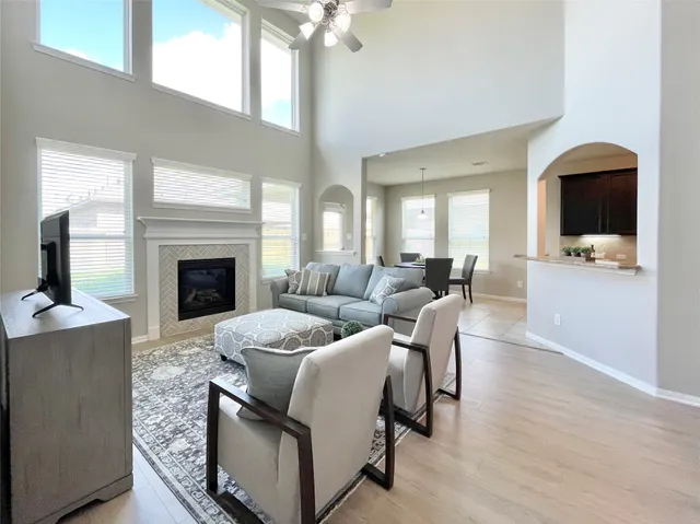 a living room with furniture and a fireplace