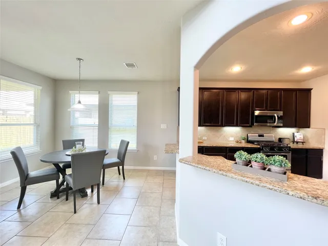 a view of a dining room with furniture