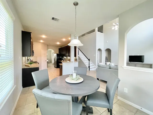a view of a dining room with furniture