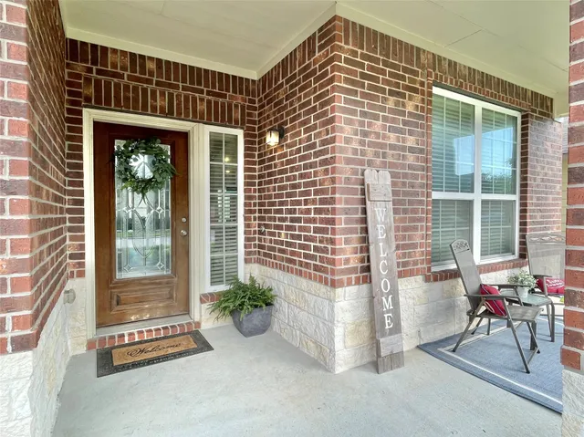 a view of potted plant in front of a door