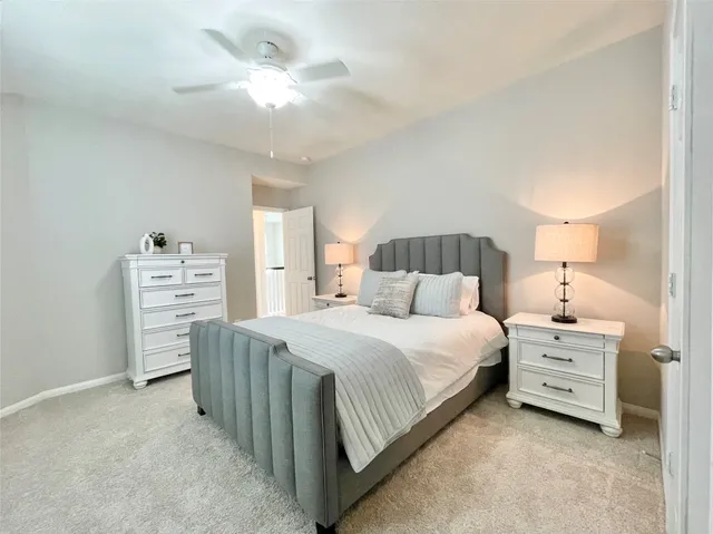 a bed room with a bed and a chandelier