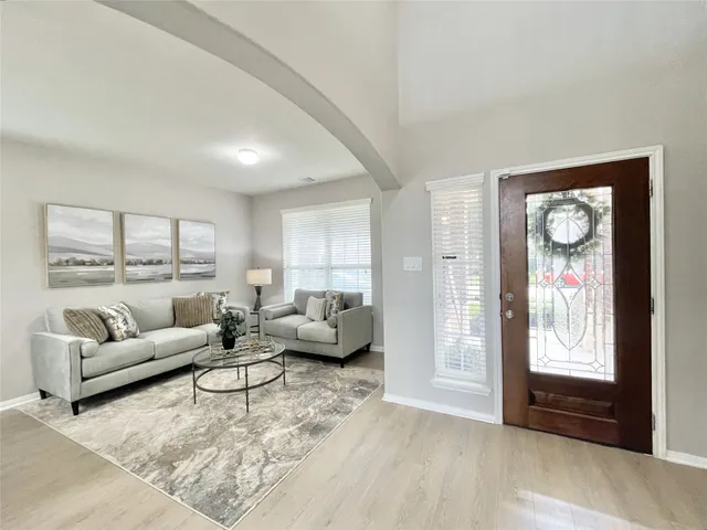 a living room with furniture and a window