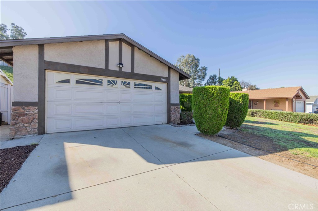 14601 Long View Drive Fontana, CA 92337 - Photo 2 of 33 a front view of a house with garden