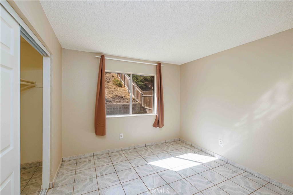 14601 Long View Drive Fontana, CA 92337 - Photo 22 of 33 a view of an empty room and window