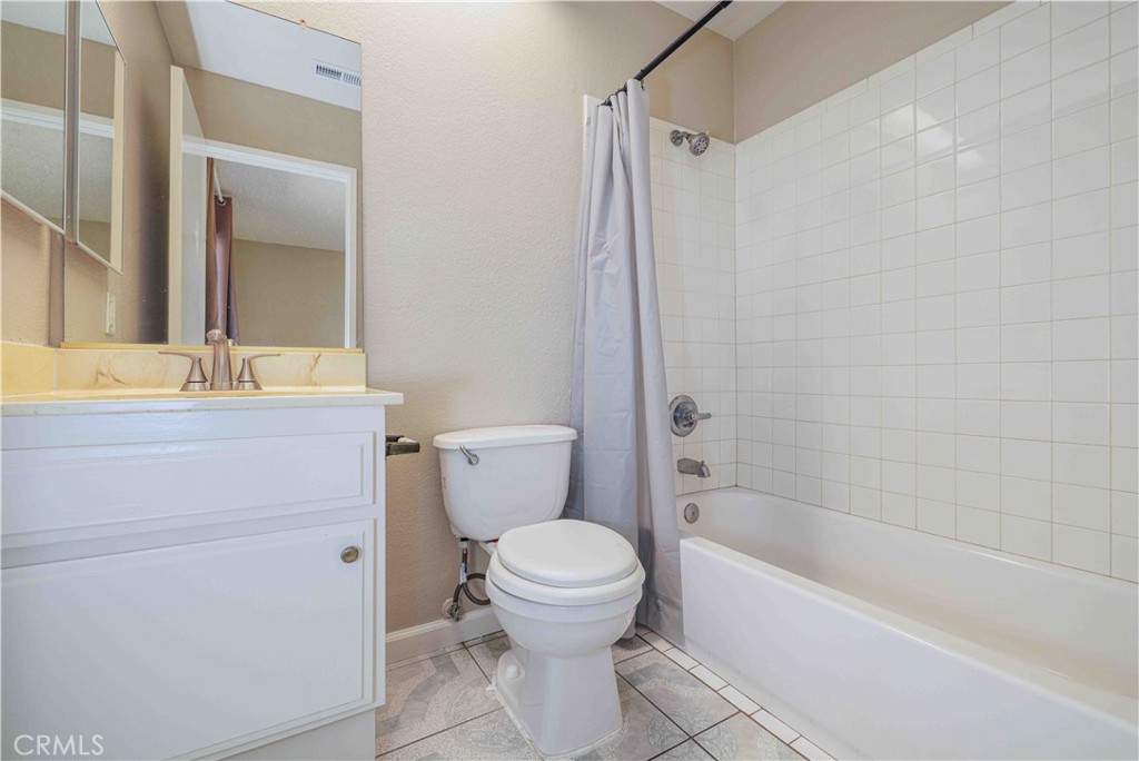 14601 Long View Drive Fontana, CA 92337 - Photo 24 of 33 a bathroom with a sink a toilet and a bathtub