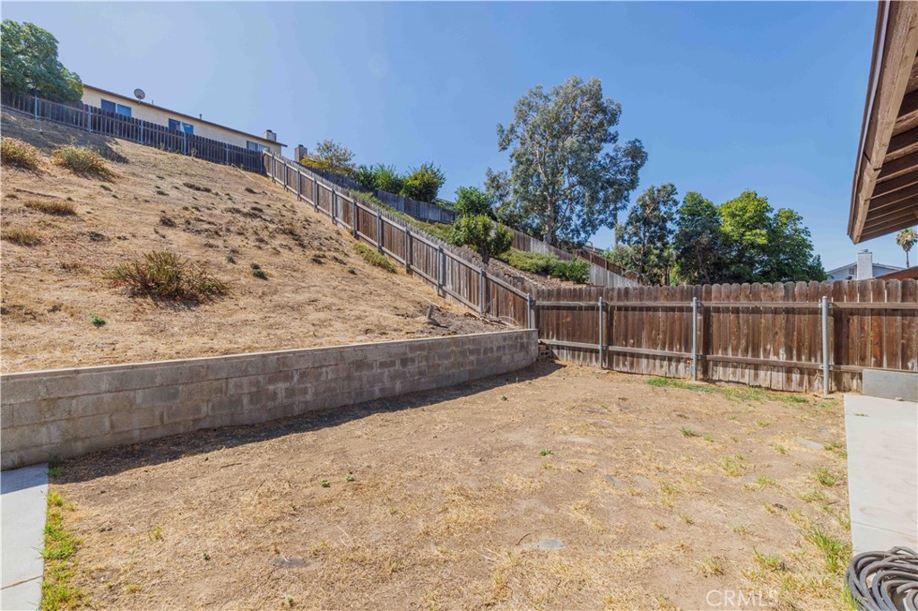 14601 Long View Drive Fontana, CA 92337 - Photo 29 of 33 a view of small yard with wooden fence