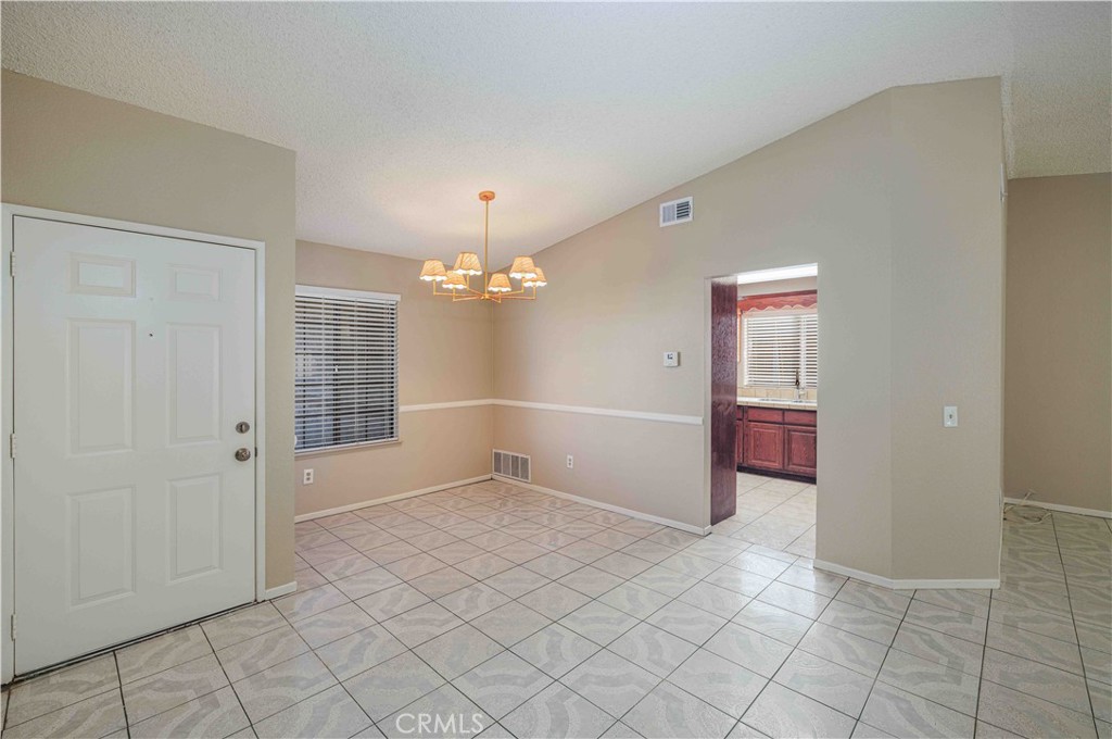 14601 Long View Drive Fontana, CA 92337 - Photo 5 of 33 wooden floor in an empty room with a window