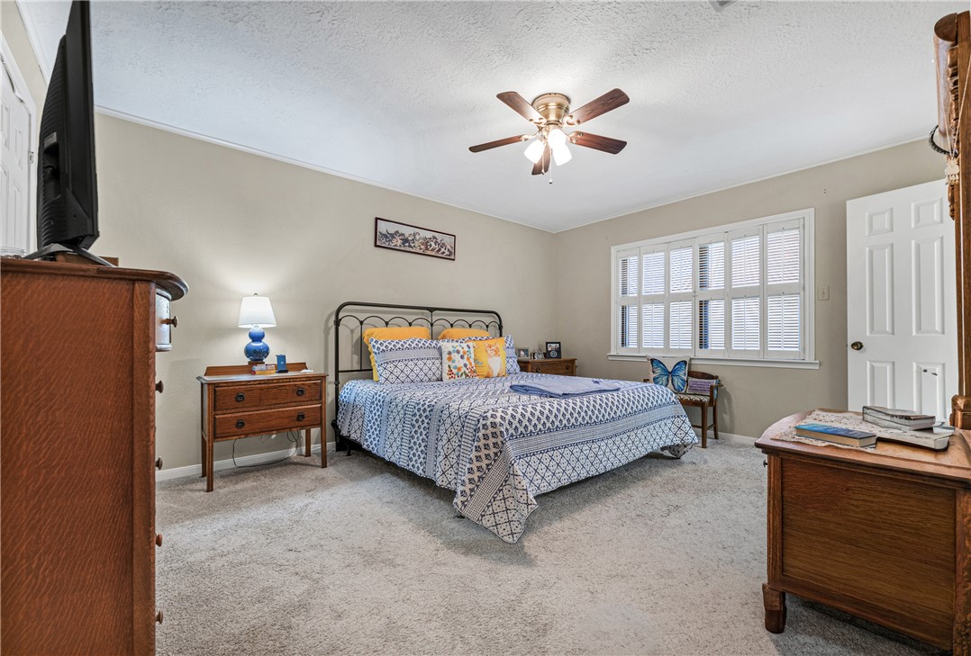 2911 Braeburn Street Bryan, TX 77802 - Photo 21 of 30 Spacious Master Bedroom with shutters, nice sized walk-in closet and Master Bath.