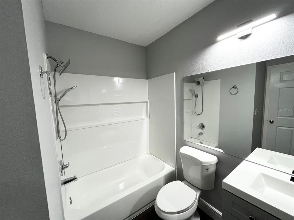 4352 South Kirkman Road, Unit 1203 Orlando, FL 32811 - Photo 14 of 27 Master en-suite with new tub/shower, toilet, vanity and flooring