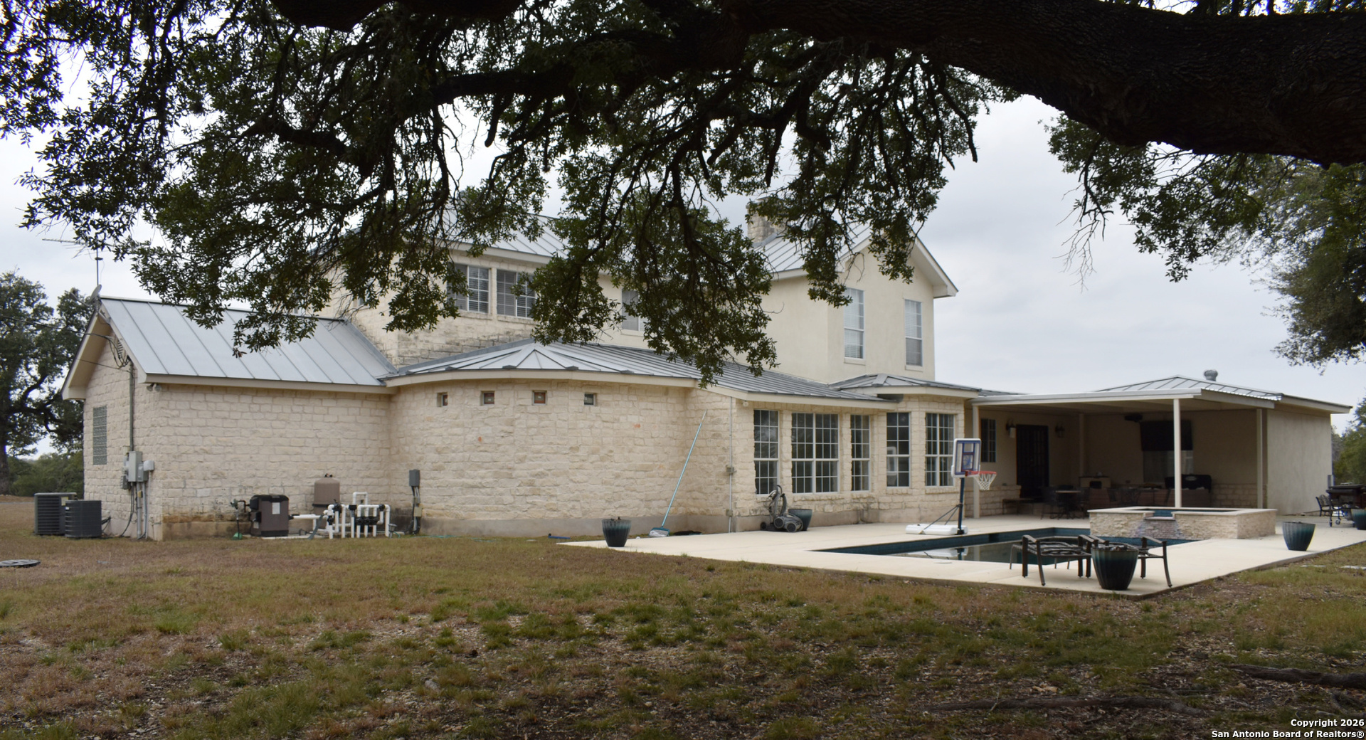 32010 Oak Ridge Parkway Bulverde, TX 78163 - Photo 11 of 48 a view of a house with backyard and sitting area