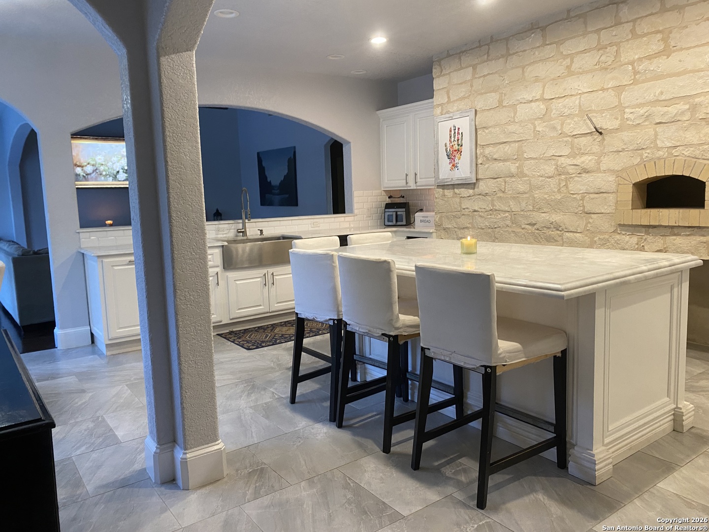 32010 Oak Ridge Parkway Bulverde, TX 78163 - Photo 22 of 48 a kitchen with a sink and a refrigerator