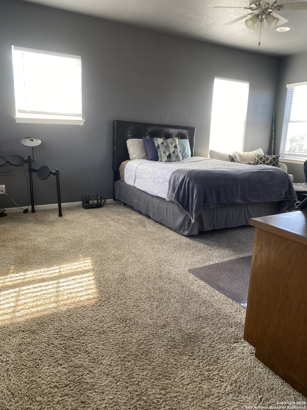 32010 Oak Ridge Parkway Bulverde, TX 78163 - Photo 33 of 48 a spacious bedroom with a bed and window