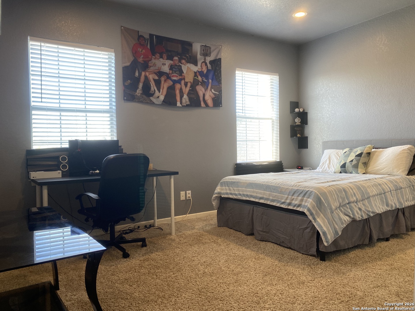 32010 Oak Ridge Parkway Bulverde, TX 78163 - Photo 36 of 48 a bedroom with a bed and a desk