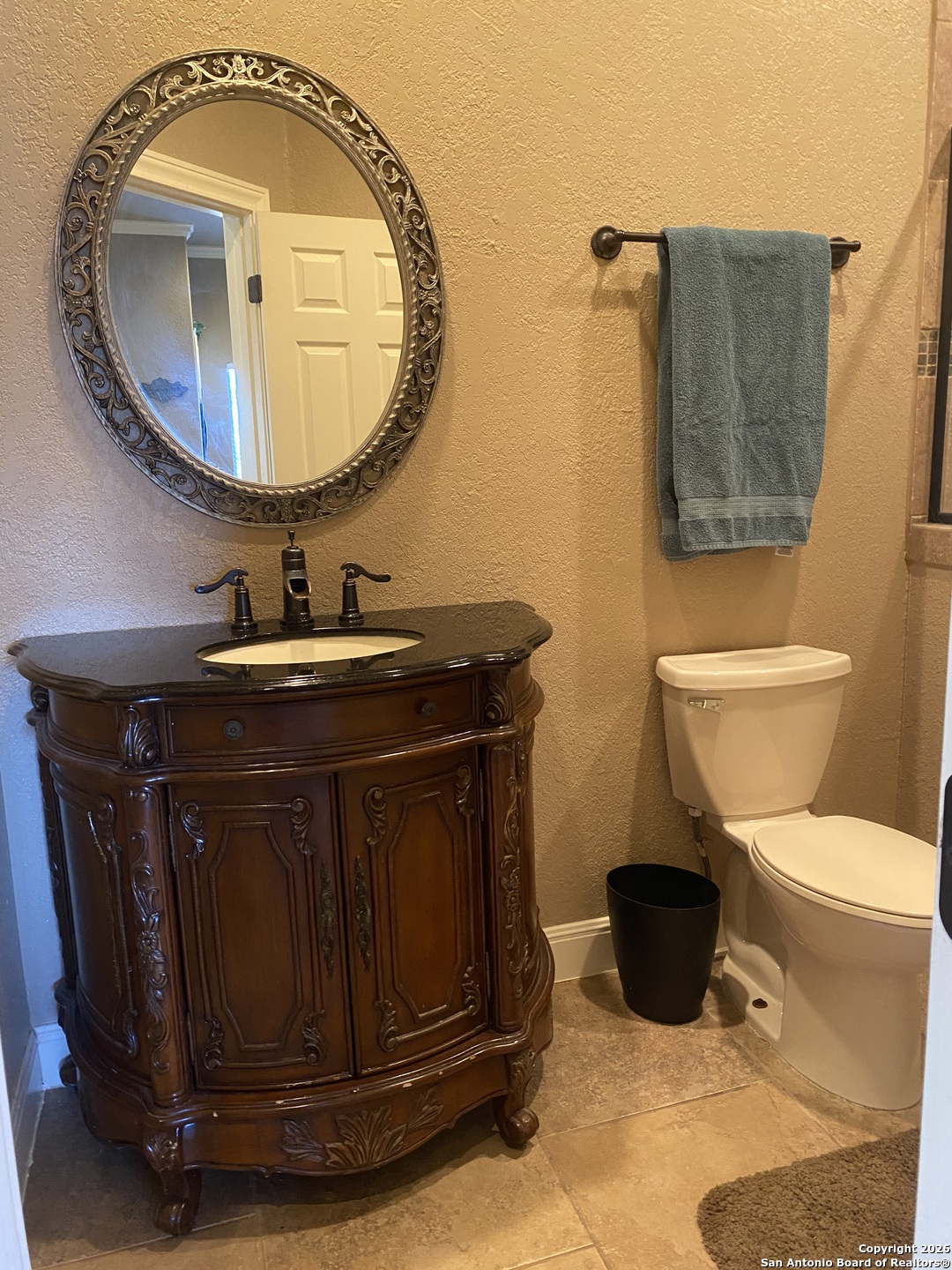 32010 Oak Ridge Parkway Bulverde, TX 78163 - Photo 42 of 48 a bathroom with a sink and a mirror