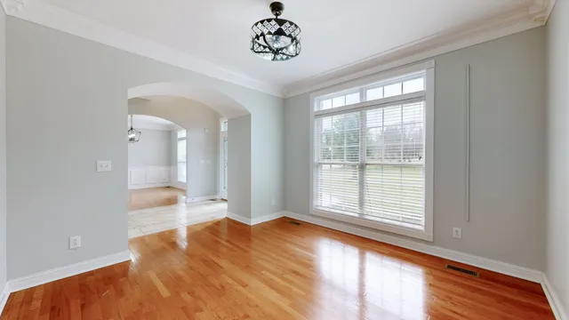 a view of a house with a swimming pool and sitting area