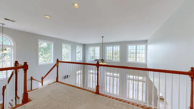 a view of a house with a yard porch and sitting area