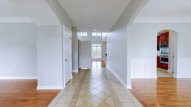 a spacious bathroom with a mirror sink and shower