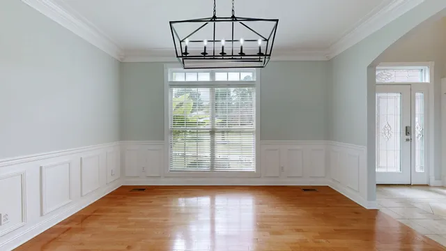 a view of a kitchen with stainless steel appliances granite countertop a refrigerator and a sink