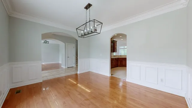 a kitchen with stainless steel appliances a stove and a refrigerator