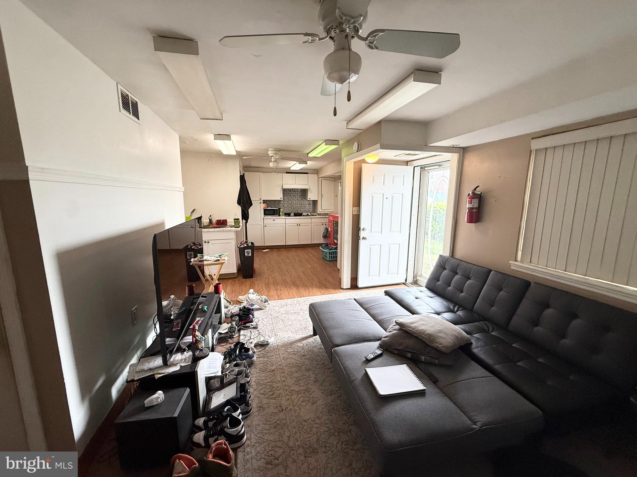 401 North Springfield Road Clifton Heights, PA 19018 - Photo 12 of 14 a living room with furniture and a large window
