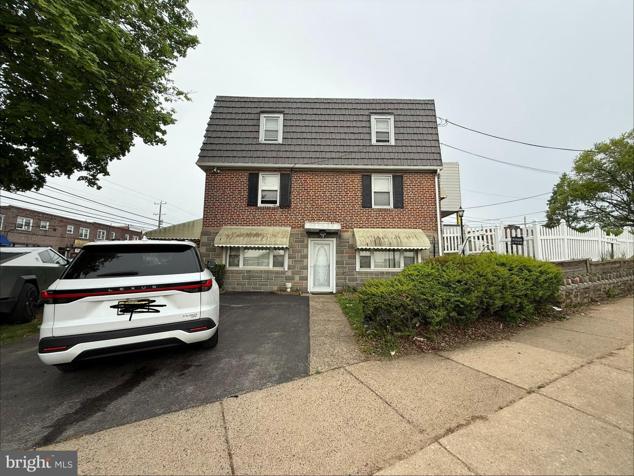 401 North Springfield Road Clifton Heights, PA 19018 - Photo 2 of 14 a car parked in front of a house