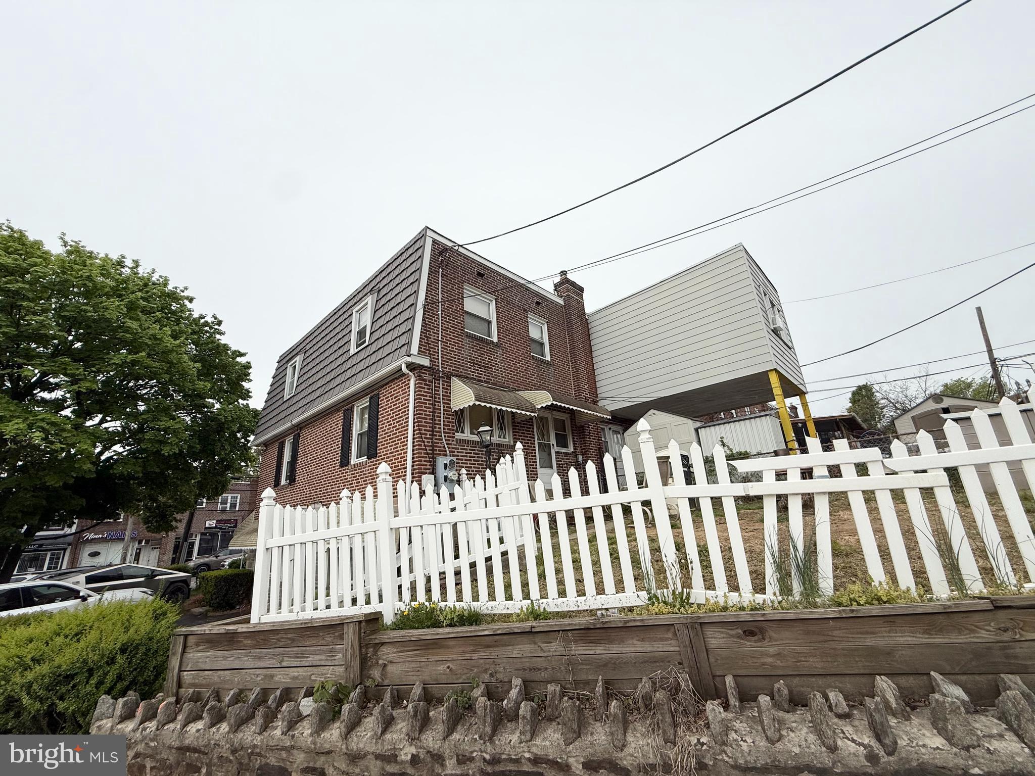 401 North Springfield Road Clifton Heights, PA 19018 - Photo 3 of 14 a front view of a house with a fence