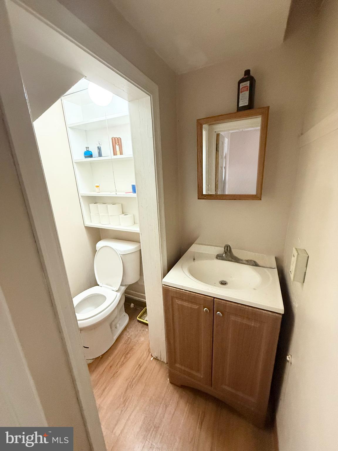 401 North Springfield Road Clifton Heights, PA 19018 - Photo 4 of 14 a bathroom with a toilet sink and mirror