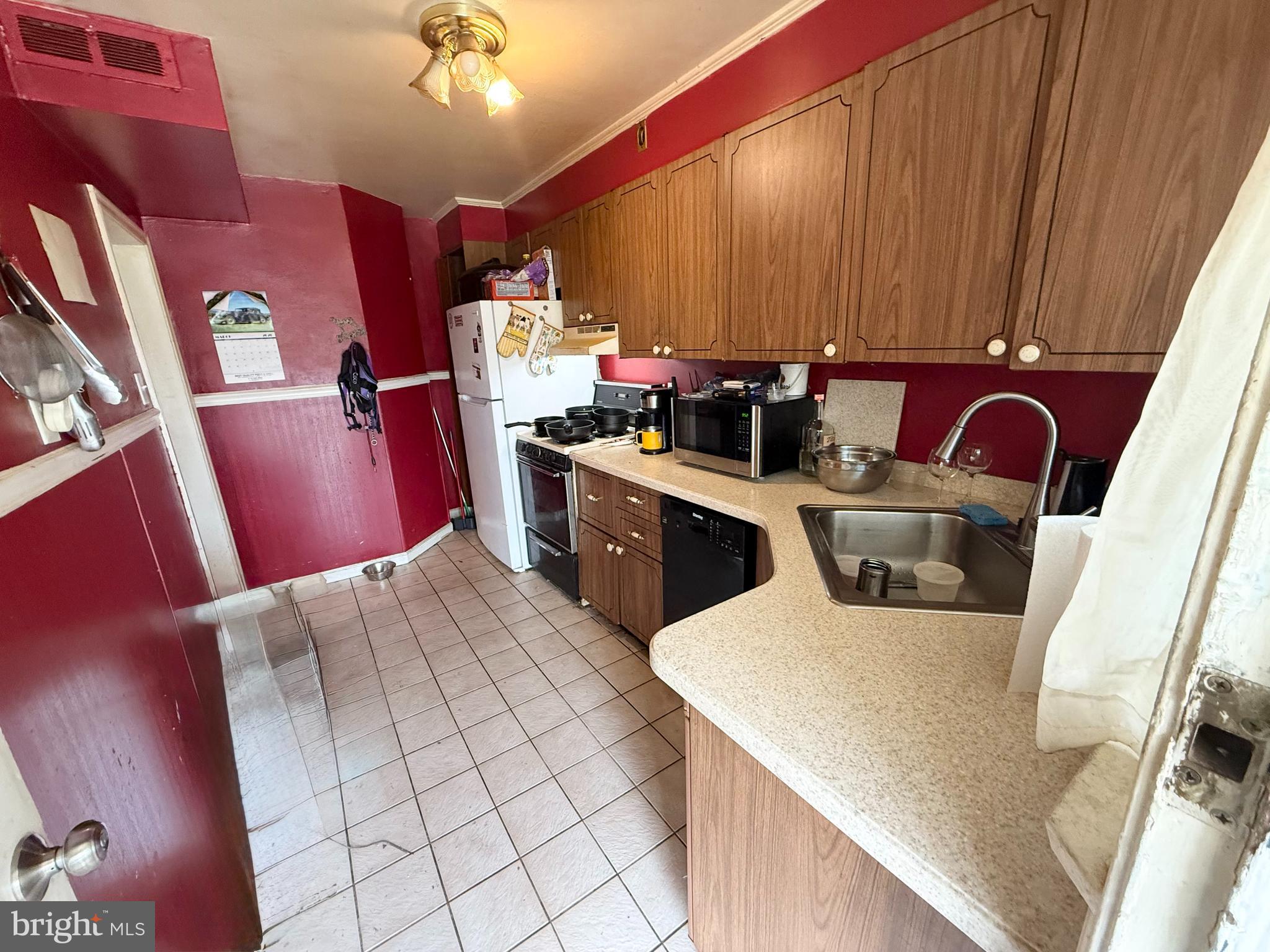 401 North Springfield Road Clifton Heights, PA 19018 - Photo 9 of 14 a kitchen with cabinets and chairs