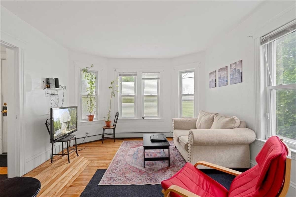 3 Wallace Street Worcester, MA 01605 - Photo 7 of 29 a living room with furniture and wooden floor