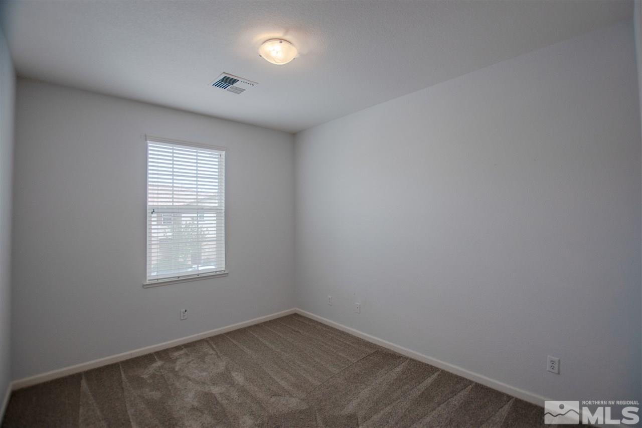 1900 Wind Ranch Road, Unit RENO Reno, NV 89521 - Photo 14 of 25 an empty room with a window