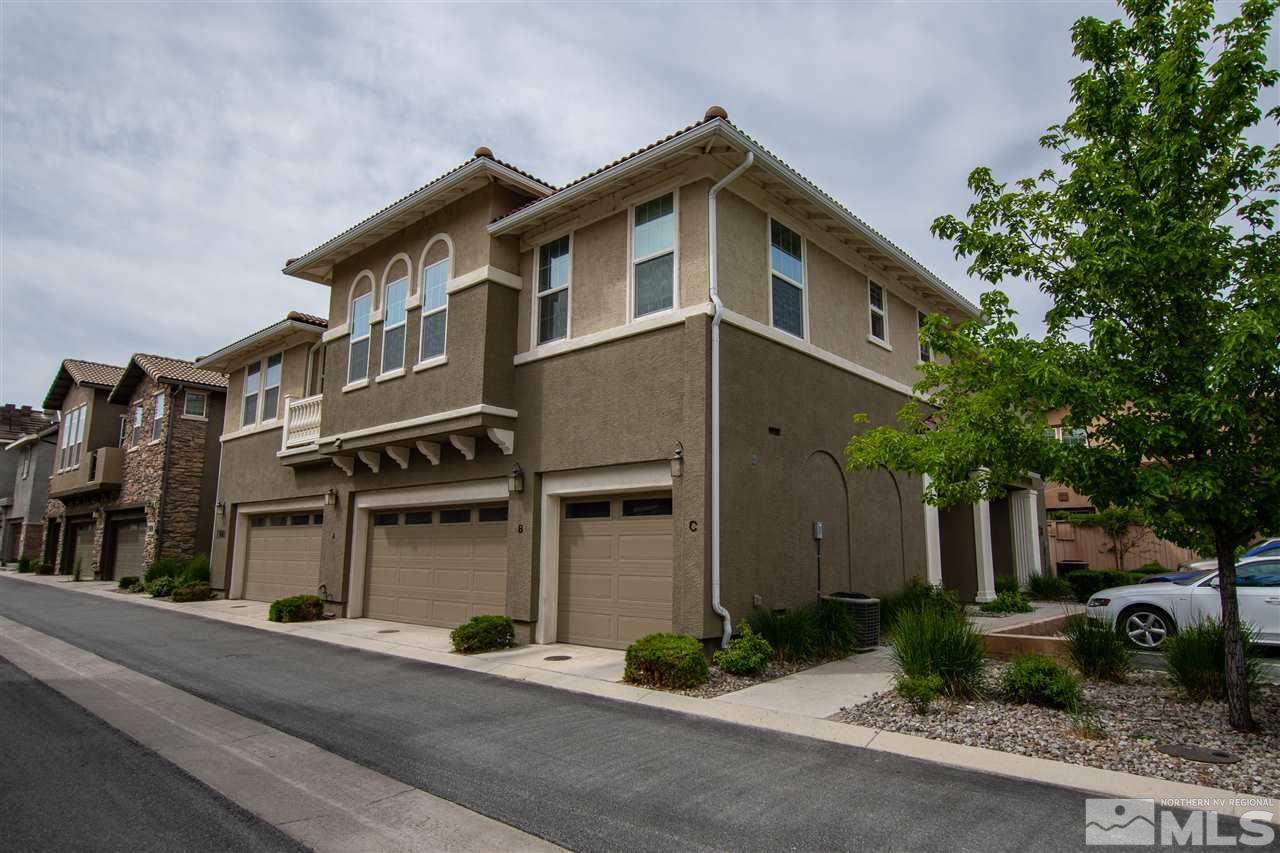 1900 Wind Ranch Road, Unit RENO Reno, NV 89521 - Photo 2 of 25 a front view of a house with garden