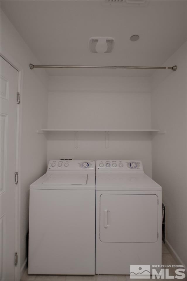 1900 Wind Ranch Road, Unit RENO Reno, NV 89521 - Photo 23 of 25 a utility room with dryer and washer