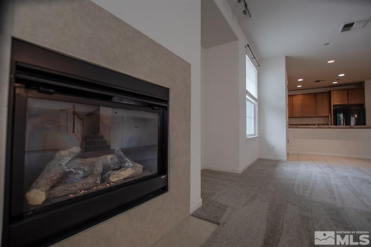1900 Wind Ranch Road, Unit RENO Reno, NV 89521 - Photo 10 of 25 a view of a fireplace in a room