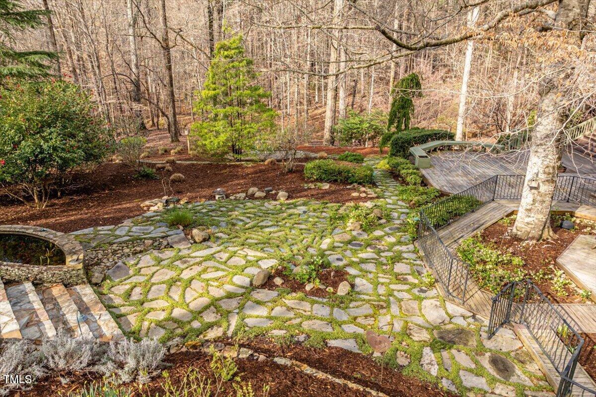 10729 Trego Trail Raleigh, NC 27614 - Photo 60 of 65 View of the landscaped backyard from the pool decking.
