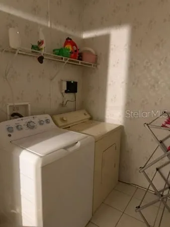 a utility room with dryer and washer