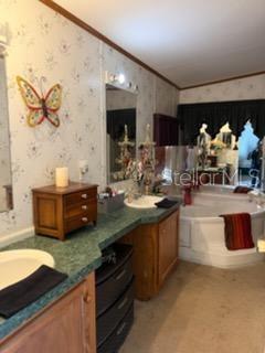 13921 Pine Meadow Road Kathleen, FL 33849 - Photo 15 of 25 a kitchen with stainless steel appliances granite countertop a sink and a stove