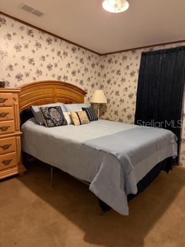 13921 Pine Meadow Road Kathleen, FL 33849 - Photo 21 of 25 a bedroom with a bed and a window