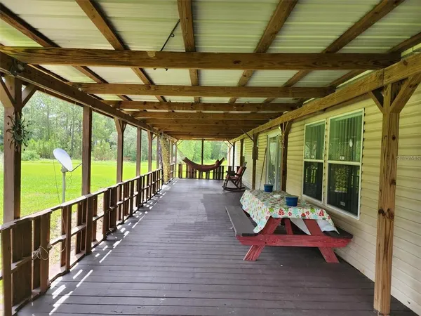 a view of a deck with wooden floor