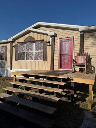 a kitchen with table and chairs