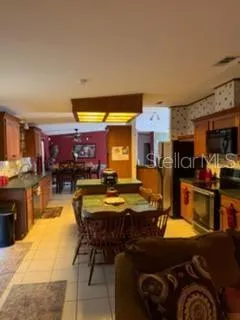 a view of a kitchen and dining area